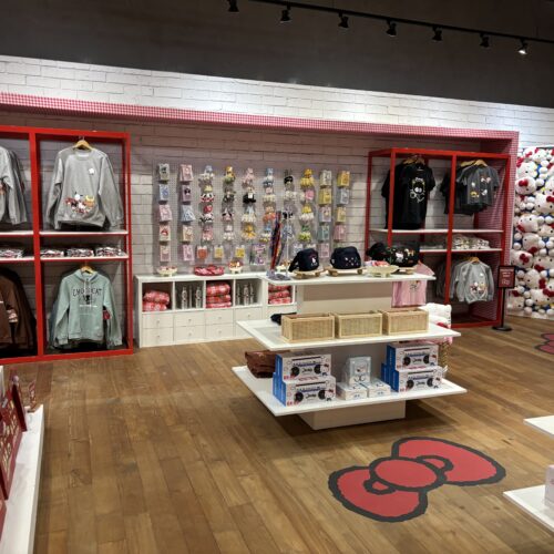 Sanrio merchandise display with custom shelving and themed décor at the Hello Kitty Del Amo pop-up.