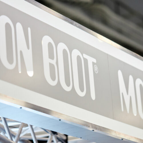 Moon Boot logo signage across the booth structure at the Las Vegas trade show