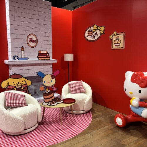 Cozy fireplace photo-op scene featuring Sanrio characters inside the Hello Kitty pop-up.